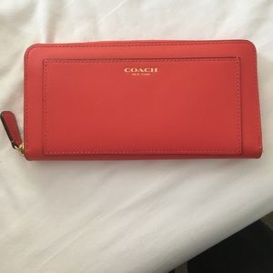 New without tags coach zip around wallet in coral